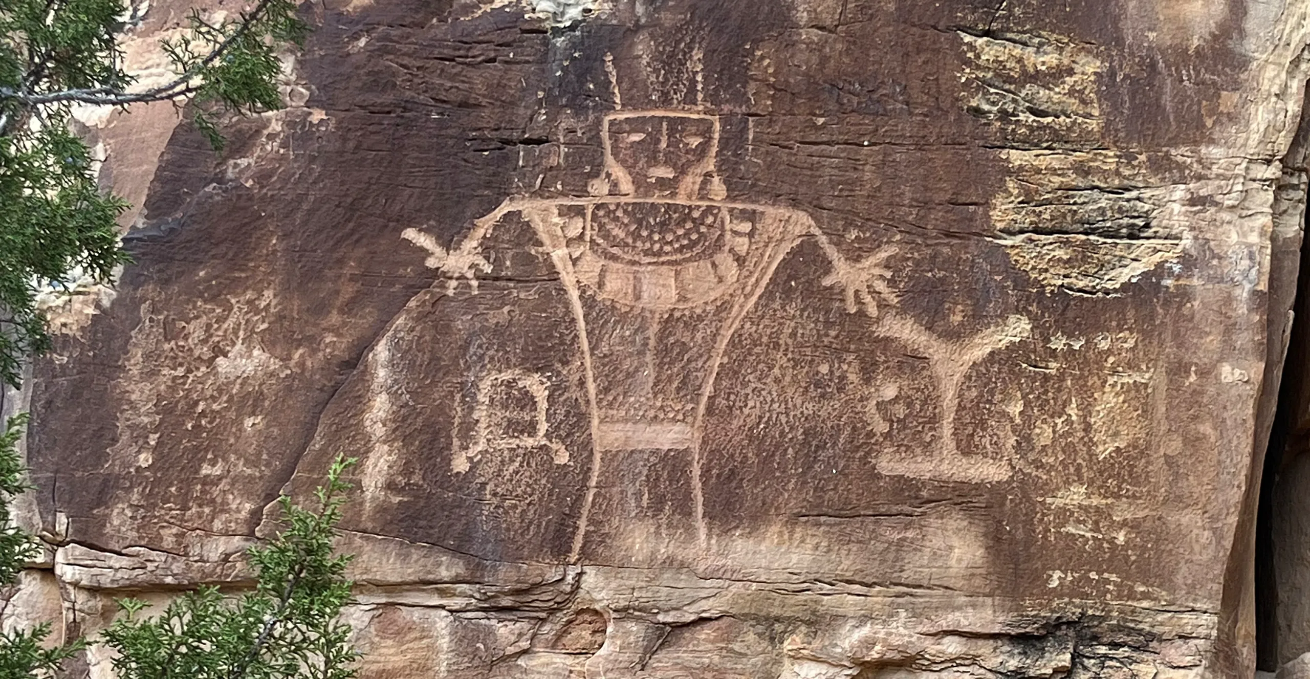 Anthropomorph petroglyph on cliff face at McConkie Ranch in Vernal, Utah